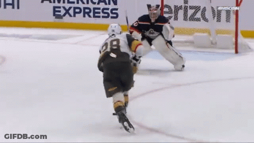 A Hockey Player With The Number 28 On Their Jersey GIF