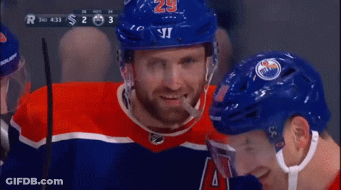 A Hockey Player With The Number 29 On His Helmet Is Smiling GIF