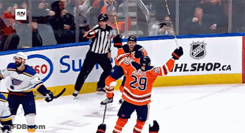 A Hockey Player With The Number 29 On His Jersey Celebrates His Goal GIF