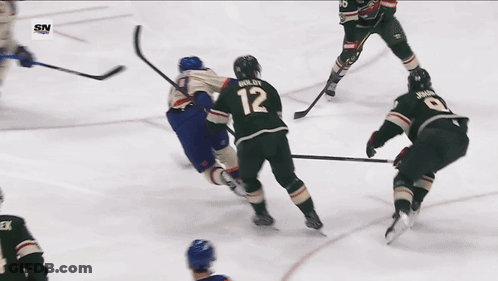 A Hockey Player With The Number 29 On His Jersey Is Holding A Hockey Stick GIF
