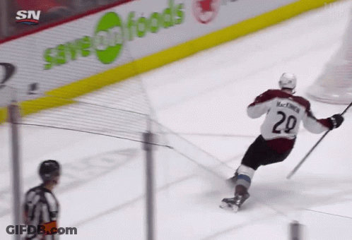 A Hockey Player With The Number 29 On His Jersey Is Skating On The Ice GIF