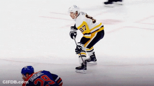 A Hockey Player With The Number 29 On His Jersey Stands On The Ice GIF