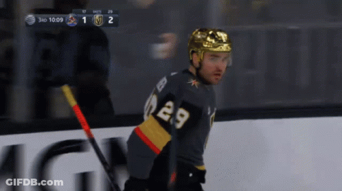 A Hockey Player With The Number 29 On His Jersey Stands On The Ice GIF