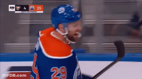 A Hockey Player With The Number 29 On His Shirt GIF