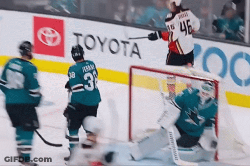 A Hockey Player With The Number 3 On His Jersey Stands On The Ice GIF
