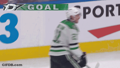 A Hockey Player With The Number 3 On The Wall GIF