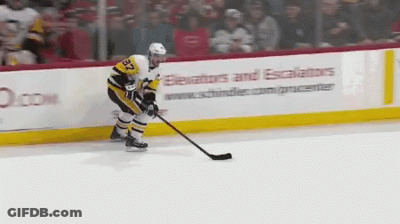 A Hockey Player With The Number 32 On His Jersey Stands On The Ice GIF