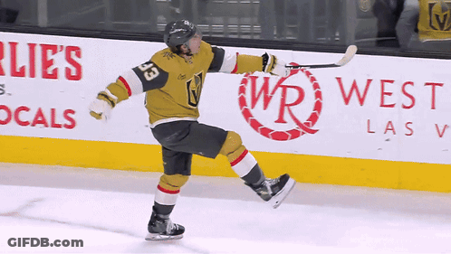 A Hockey Player With The Number 33 On His Jersey Skates On The Ice GIF