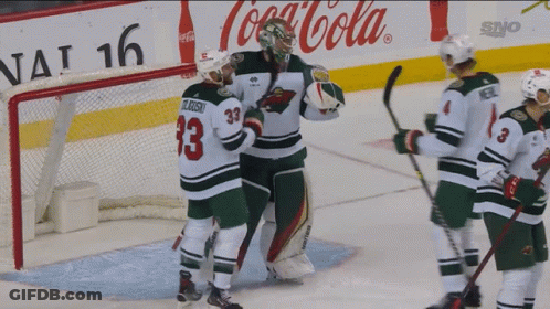 A Hockey Player With The Number 33 On His Jersey Stands On The Ice GIF