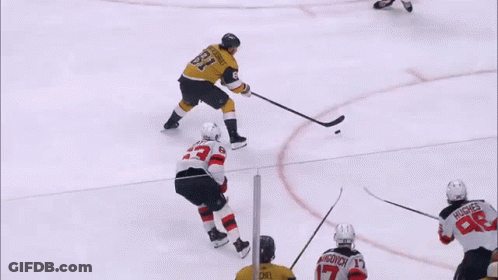 A Hockey Player With The Number 33 On His Shirt GIF