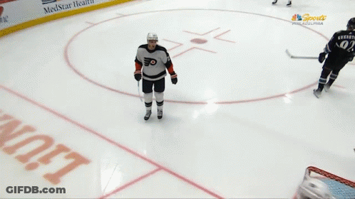 A Hockey Player With The Number 34 On His Back GIF