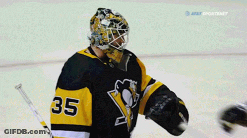 A Hockey Player With The Number 35 On His Jersey Talks To Another Player GIF