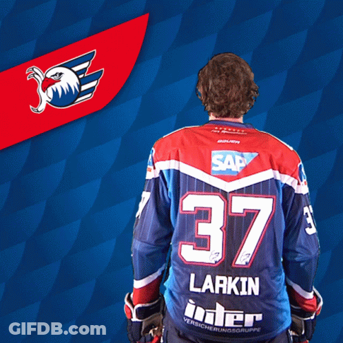 A Hockey Player With The Number 37 On His Back GIF