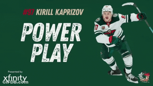 A Hockey Player With The Number 37 On His Jersey Is Holding A Hockey Stick GIF