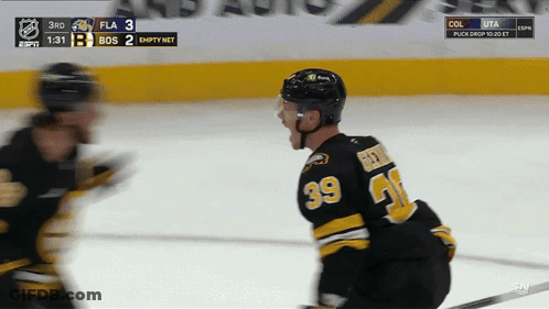 A Hockey Player With The Number 39 On His Back GIF