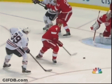 A Hockey Player With The Number 39 On His Jersey Stands On The Ice GIF