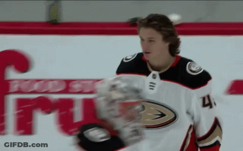 A Hockey Player With The Number 4 On His Jersey Stands On The Ice GIF