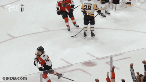A Hockey Player With The Number 46 On His Jersey Is Being Lifted In The Air By Fans GIF