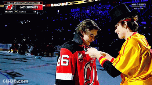 A Hockey Player With The Number 46 On His Jersey Is Being Pinned GIF