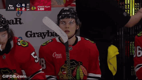 A Hockey Player With The Number 5 On His Back GIF