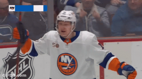 A Hockey Player With The Number 50 On His Jersey Celebrates GIF