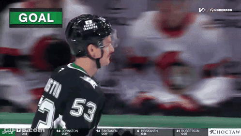 A Hockey Player With The Number 53 On His Jersey Stands On The Ice GIF