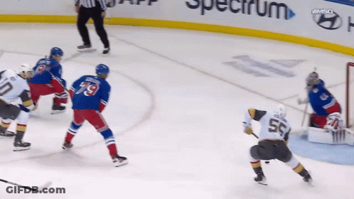 A Hockey Player With The Number 55 On His Back GIF