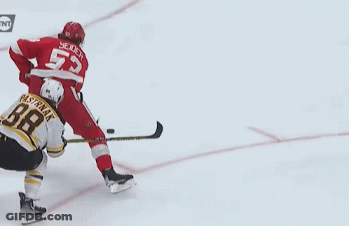 A Hockey Player With The Number 55 On His Back GIF