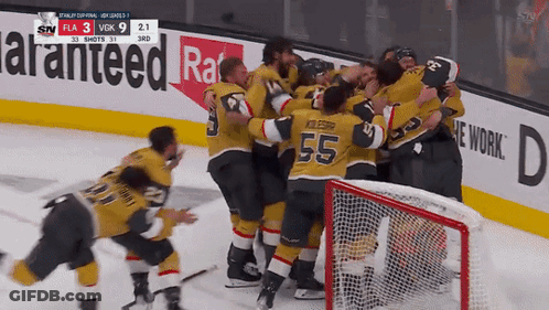A Hockey Player With The Number 55 On His Jersey Is Hugging His Teammates GIF
