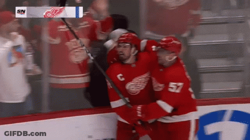 A Hockey Player With The Number 57 On His Back GIF