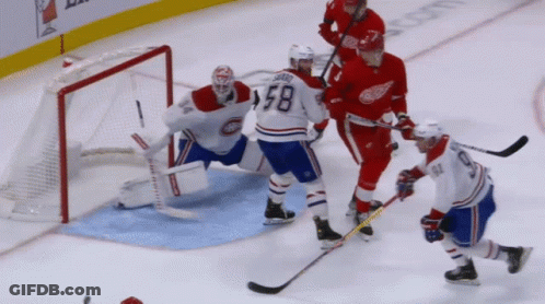 A Hockey Player With The Number 58 On His Shirt GIF
