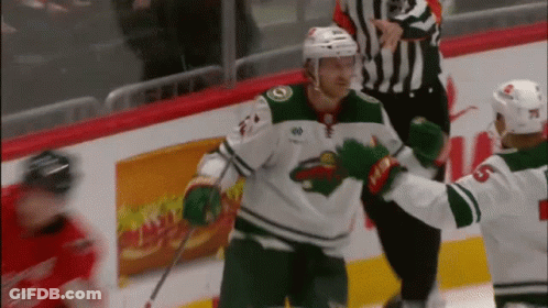A Hockey Player With The Number 6 On His Jersey Hugs Another Player GIF