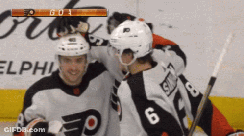 A Hockey Player With The Number 6 On His Jersey Is Hugging Another Player GIF