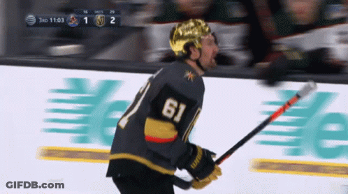 A Hockey Player With The Number 61 On His Back GIF