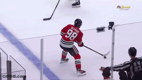 A Hockey Player With The Number 68 On His Shirt GIF