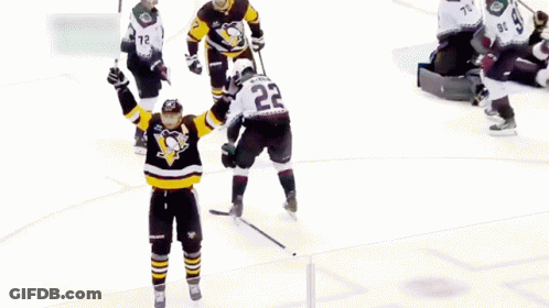 A Hockey Player With The Number 7 On His Jersey Is Kneeling On The Ice GIF