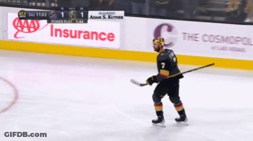 A Hockey Player With The Number 7 On His Jersey Stands On The Ice GIF