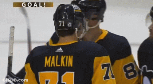 A Hockey Player With The Number 71 On His Back GIF