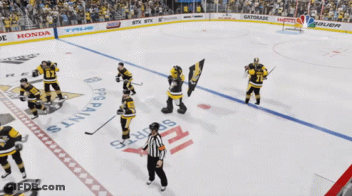 A Hockey Player With The Number 71 On His Jersey Is Surrounded By Other Players GIF