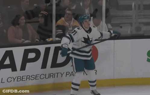 A Hockey Player With The Number 71 On His Jersey Stands On The Ice GIF