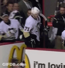 A Hockey Player With The Number 71 On His Shirt GIF