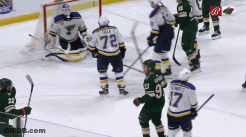 A Hockey Player With The Number 72 On His Back GIF