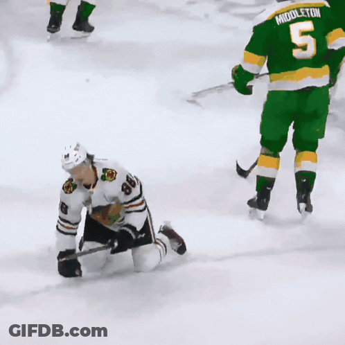 A Hockey Player With The Number 8 On His Jersey Is Kneeling On The Ice GIF