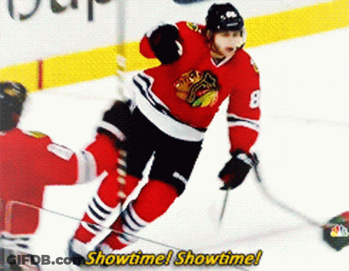 A Hockey Player With The Number 8 On His Jersey Is Skating GIF