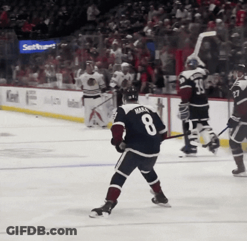 A Hockey Player With The Number 8 On His Jersey Stands On The Ice GIF