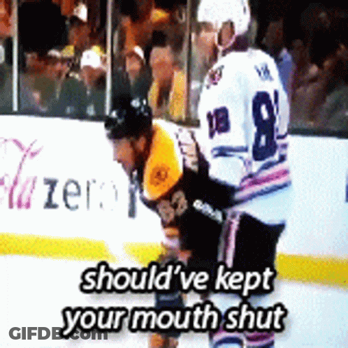 A Hockey Player With The Number 8 On His Jersey Stands On The Ice GIF