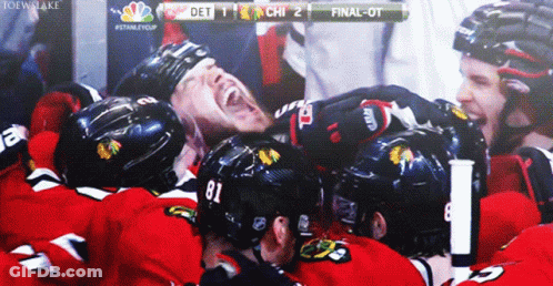A Hockey Player With The Number 81 On His Helmet Is Surrounded By Other Players GIF