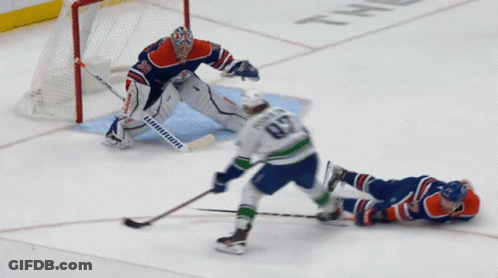 A Hockey Player With The Number 82 On His Jersey Is Laying On The Ice GIF