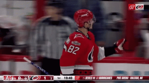 A Hockey Player With The Number 82 On His Shirt GIF