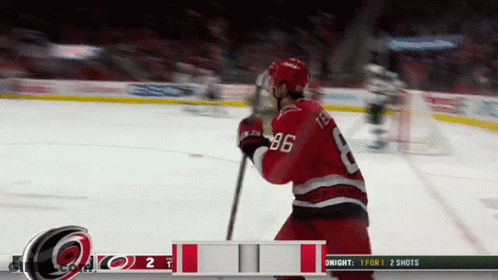 A Hockey Player With The Number 86 On His Back GIF